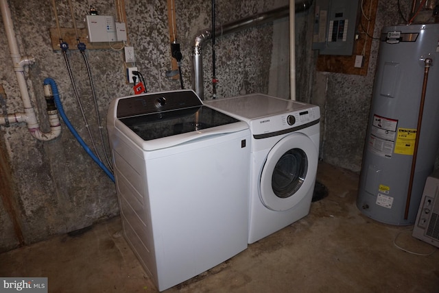 clothes washing area featuring washer and dryer, laundry area, electric panel, and electric water heater