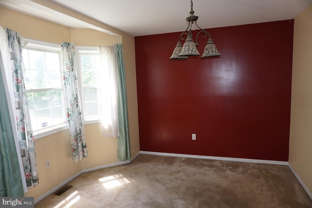 carpeted empty room featuring visible vents and baseboards