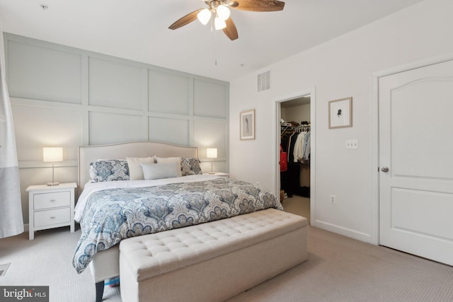 29 Enclave Ct, Annapolis, MD 21403 - bedroom with carpet, a decorative wall, a walk in closet, a closet, and a ceiling fan