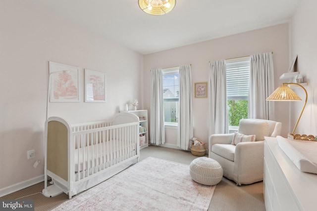 29 Enclave Ct, Annapolis, MD 21403 - bedroom with a nursery area, carpet flooring, and baseboards