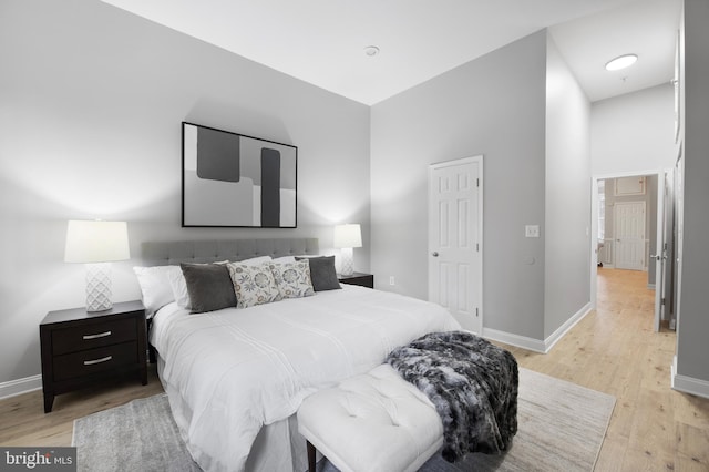 903 R St NW Unit 1, Washington, DC 20001 - bedroom featuring light wood-style floors, baseboards, and a high ceiling