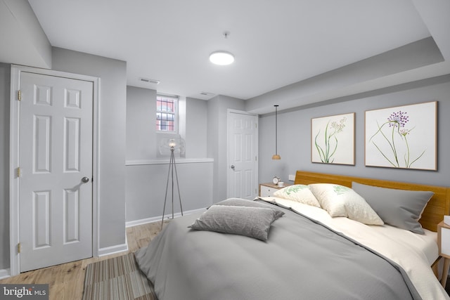 903 R St NW Unit 1, Washington, DC 20001 - bedroom featuring baseboards, visible vents, and light wood-style floors