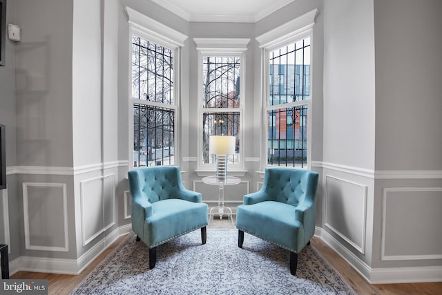 903 R St NW Unit 1, Washington, DC 20001 - living area featuring wood finished floors, ornamental molding, a decorative wall, and a wainscoted wall