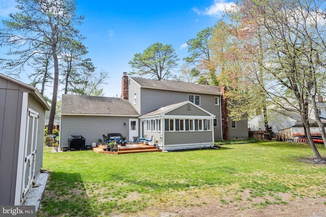 22 Cochise Cir, Medford Lakes, NJ 08055 - back of house featuring a yard, a chimney, a sunroom, and a deck