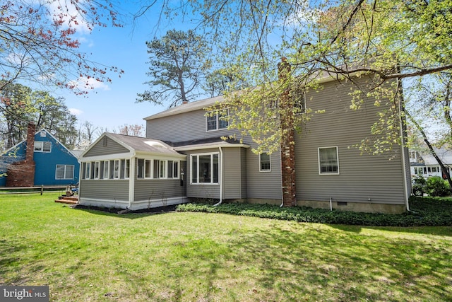 22 Cochise Cir, Medford Lakes, NJ 08055 - rear view of property featuring a lawn, fence, a chimney, and a sunroom