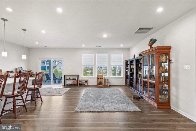 sitting room featuring dark wood finished floors, visible vents, and recessed lighting