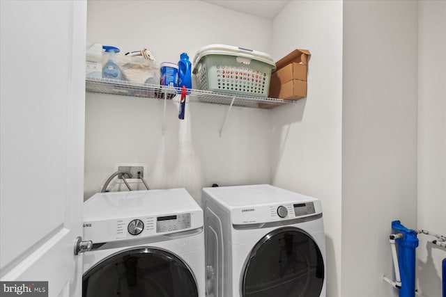 laundry area with laundry area and independent washer and dryer