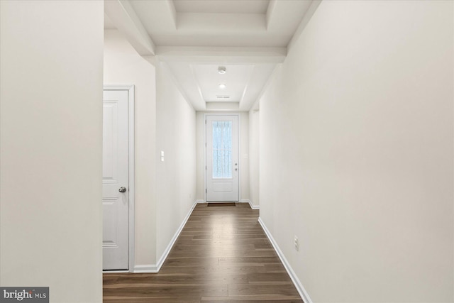 hallway with baseboards and dark wood-style floors