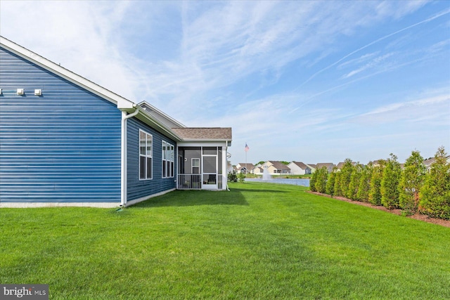 view of yard featuring a sunroom