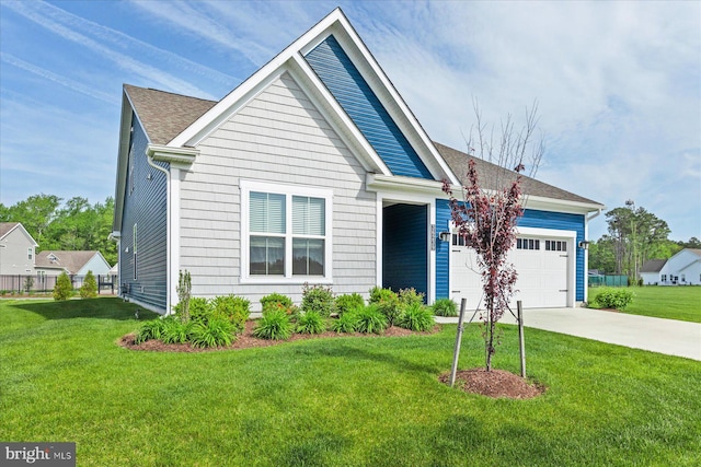 view of front of house with a front yard, a shingled roof, an attached garage, and driveway