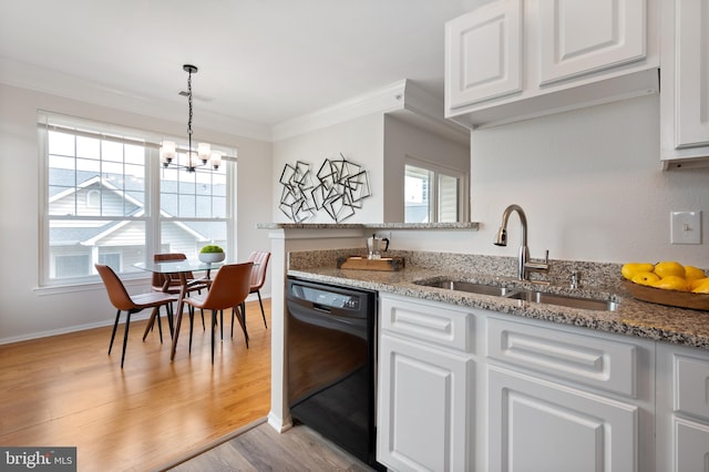 kitchen featuring an inviting chandelier, a sink, black dishwasher, white cabinetry, and ornamental molding