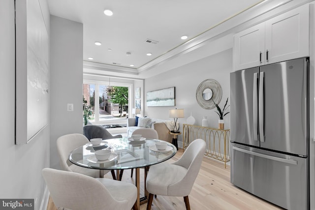 dining room featuring visible vents, recessed lighting, and light wood finished floors