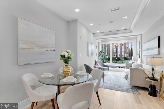 dining area with visible vents, baseboards, a chandelier, light wood-style floors, and recessed lighting