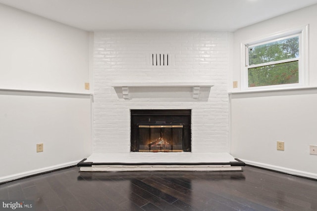 10133 Pine St, Oakton, VA 22124 - detailed view of wood finished floors, a brick fireplace, and baseboards