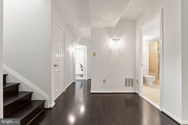 10133 Pine St, Oakton, VA 22124 - foyer with dark wood finished floors, baseboards, and stairway