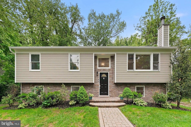 10133 Pine St, Oakton, VA 22124 - split foyer home with a front yard and a chimney