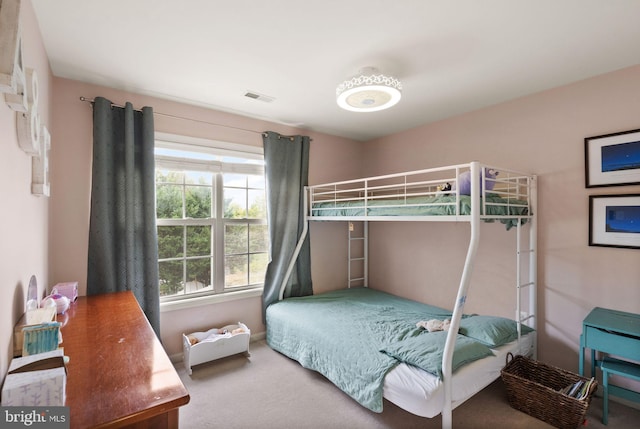 bedroom featuring carpet floors and visible vents