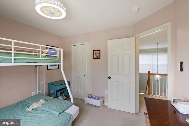 carpeted bedroom featuring a closet