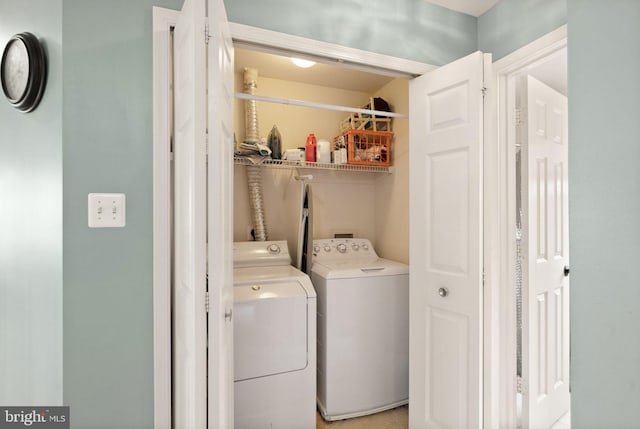 laundry area with separate washer and dryer and laundry area