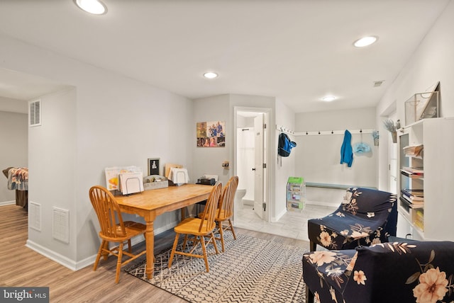 dining room with visible vents, recessed lighting, and wood finished floors