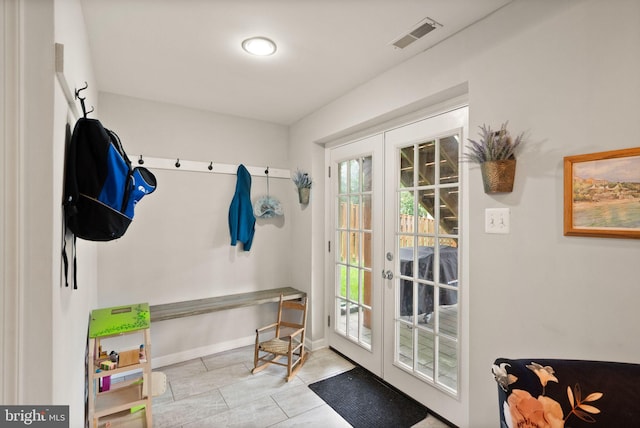 mudroom with baseboards, visible vents, french doors, and tile patterned flooring