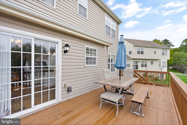 wooden deck with outdoor dining area