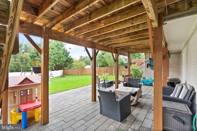 view of patio / terrace featuring an outdoor living space and a fenced backyard