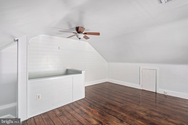 additional living space featuring vaulted ceiling, ceiling fan, hardwood / wood-style flooring, and baseboards