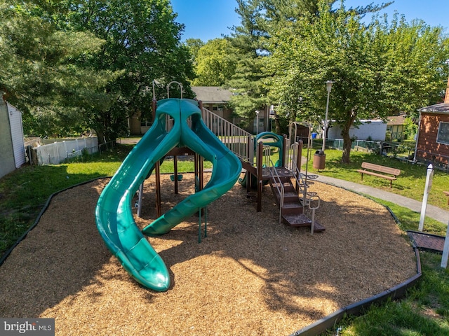 community jungle gym featuring fence