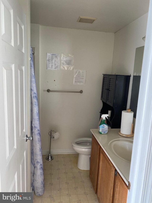 12896 Schalk Ct, Woodbridge, VA 22192 - bathroom with vanity, tile patterned floors, toilet, and curtained shower