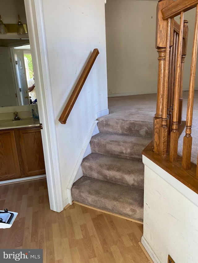 12896 Schalk Ct, Woodbridge, VA 22192 - stairs featuring wood finished floors and baseboards