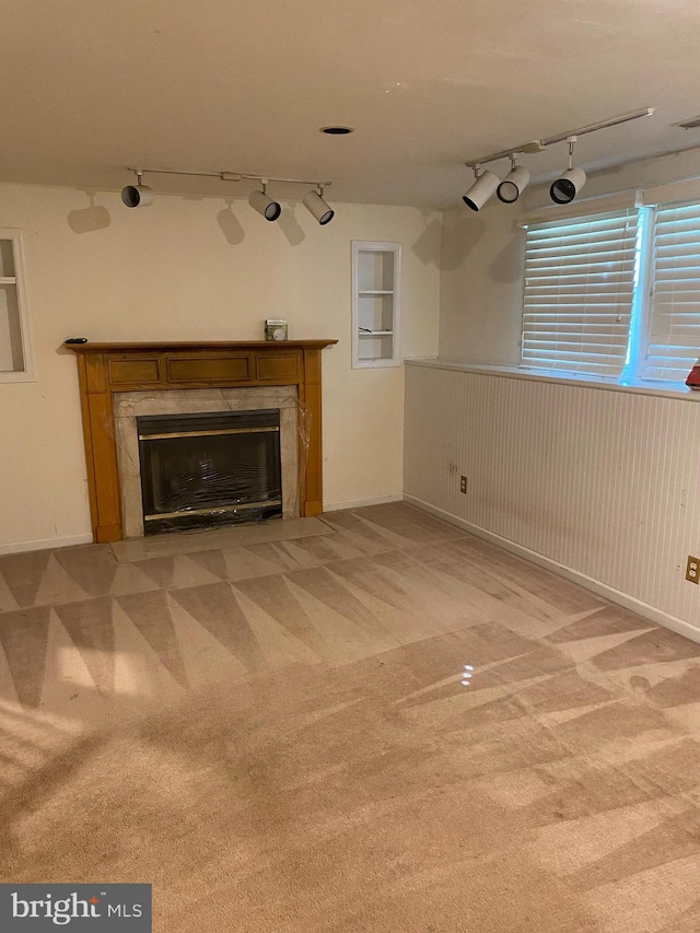 12896 Schalk Ct, Woodbridge, VA 22192 - unfurnished living room with rail lighting, a fireplace, and light carpet