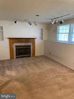 12896 Schalk Ct, Woodbridge, VA 22192 - unfurnished living room with a fireplace and rail lighting
