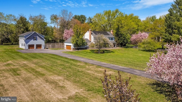 view of yard with a detached garage