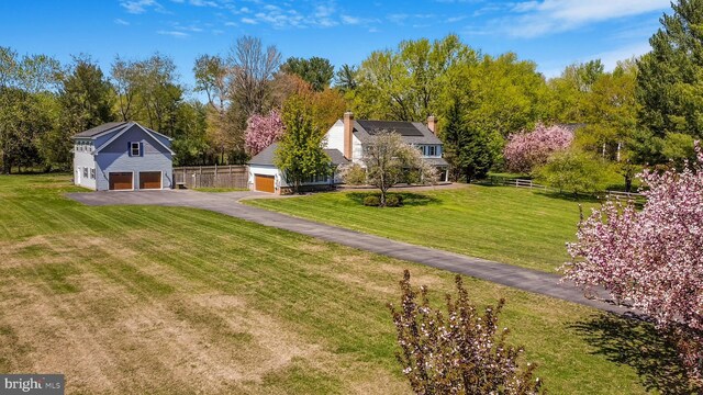 view of yard with a detached garage