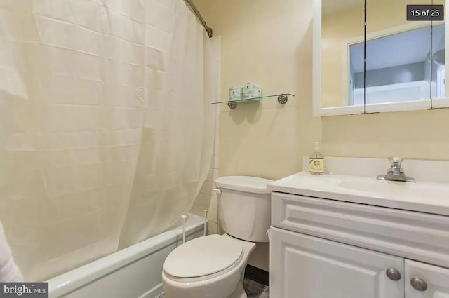 bathroom with toilet, shower / tub combo, and vanity