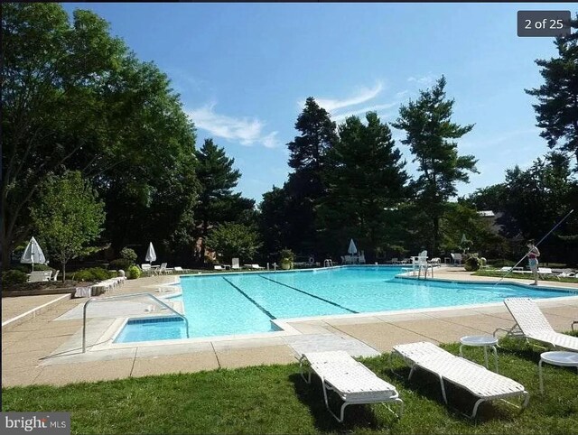 community pool with a patio