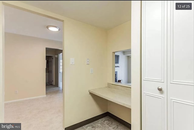 corridor featuring baseboards