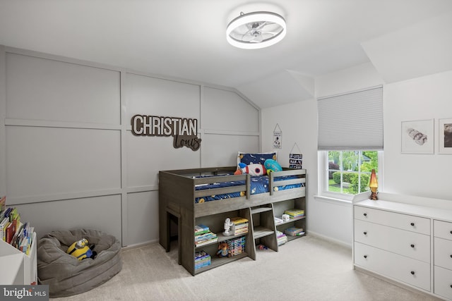 bedroom with carpet flooring, baseboards, and lofted ceiling