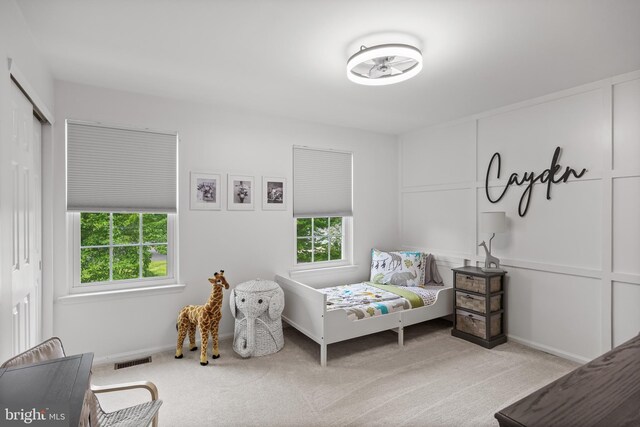 carpeted bedroom with baseboards