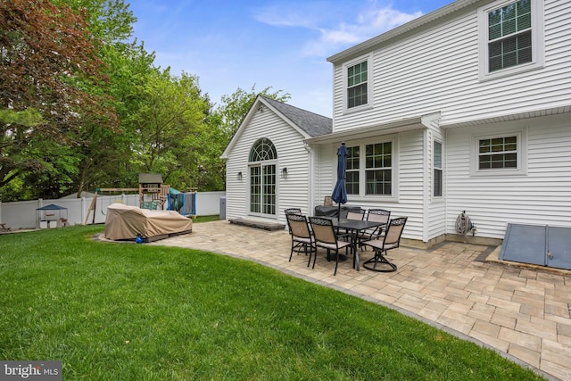 back of property featuring a patio area