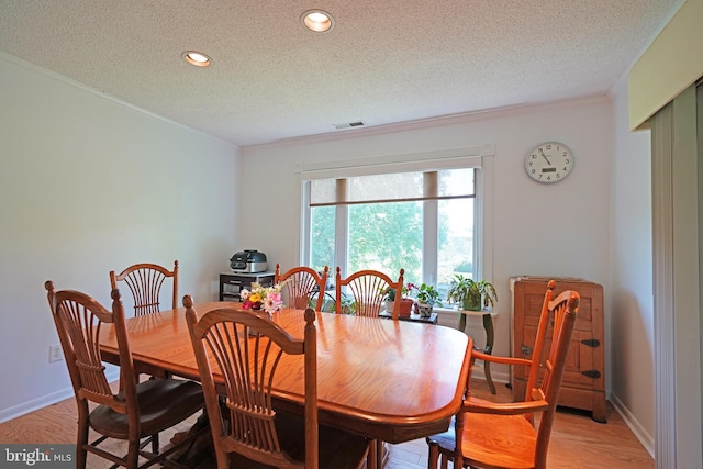 33955 Middleton Cir Unit 5, Lewes, DE 19958 - dining room featuring a textured ceiling, ornamental molding, recessed lighting, light wood-style floors, and baseboards