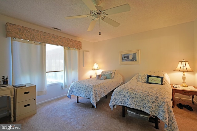 33955 Middleton Cir Unit 5, Lewes, DE 19958 - bedroom featuring carpet, baseboards, a textured ceiling, and ceiling fan