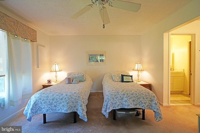 33955 Middleton Cir Unit 5, Lewes, DE 19958 - carpeted bedroom featuring ensuite bath, ceiling fan, and baseboards