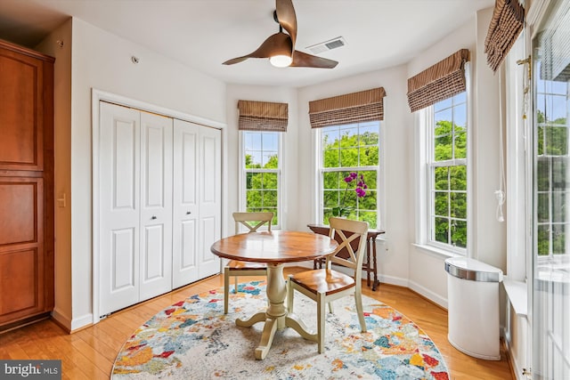 1507 Broadneck Pl Unit 403, Annapolis, MD 21409 - dining room featuring healthy amount of natural light, a ceiling fan, and light wood-style floors
