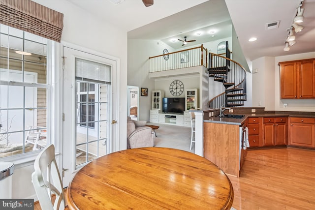1507 Broadneck Pl Unit 403, Annapolis, MD 21409 - dining area with stairs, a ceiling fan, plenty of natural light, and light wood-style flooring