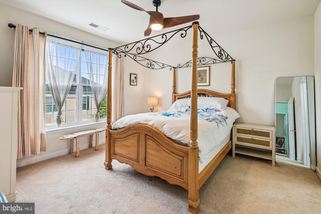 1507 Broadneck Pl Unit 403, Annapolis, MD 21409 - bedroom featuring light colored carpet, multiple windows, and a ceiling fan