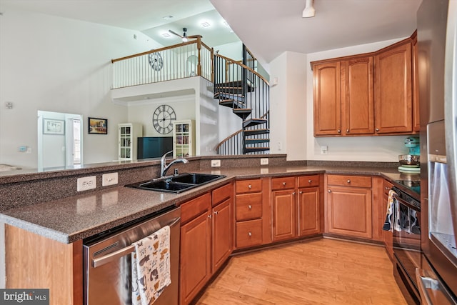 1507 Broadneck Pl Unit 403, Annapolis, MD 21409 - kitchen with stainless steel appliances, a sink, ceiling fan, brown cabinets, and a peninsula