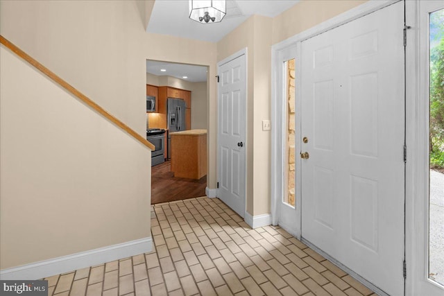 30 Morton Ct, Lawrence Township, NJ 08648 - foyer entrance featuring baseboards, brick patterned floors, plenty of natural light, and recessed lighting