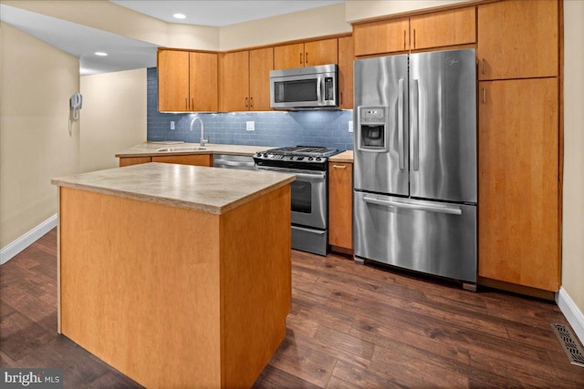 30 Morton Ct, Lawrence Township, NJ 08648 - kitchen featuring stainless steel appliances, light countertops, dark wood-style flooring, tasteful backsplash, and a center island